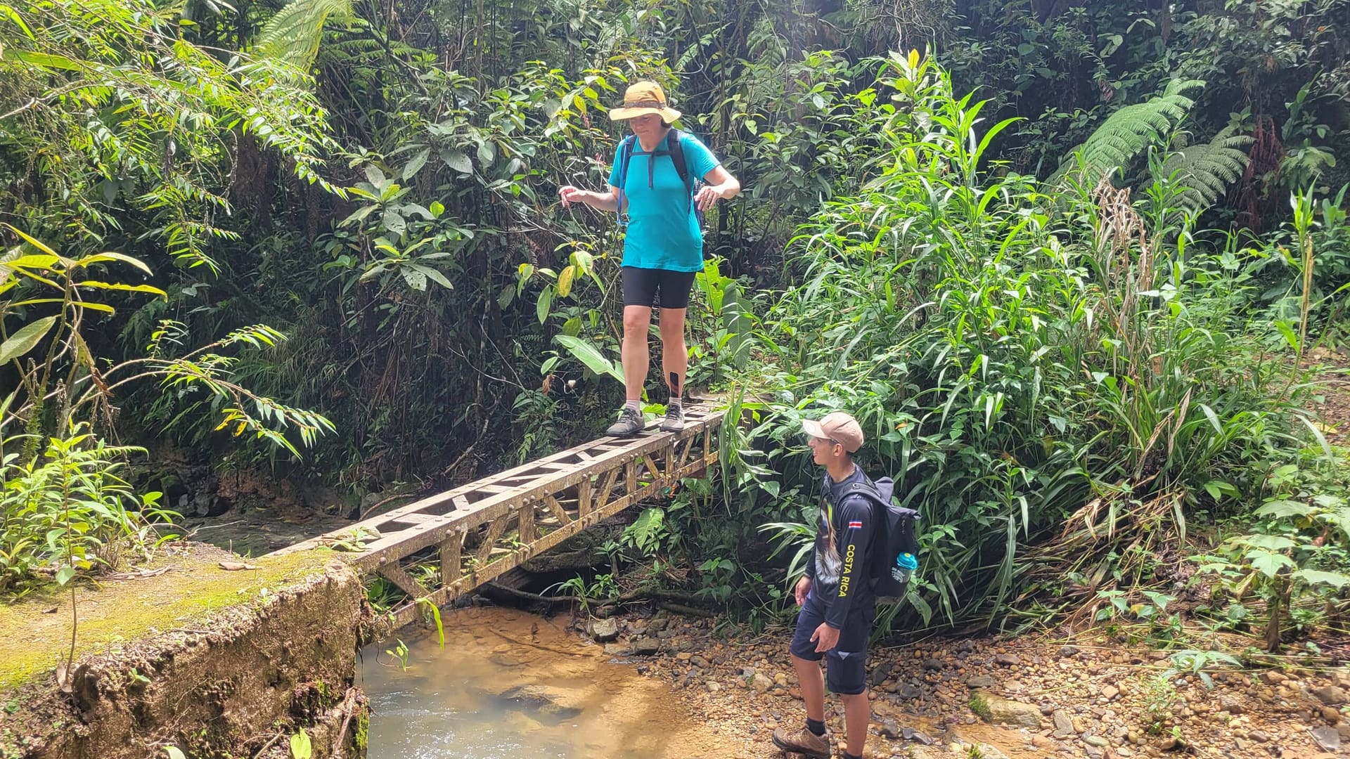 Hillary Crossing a Makeshift Bridge Below La Esperanza